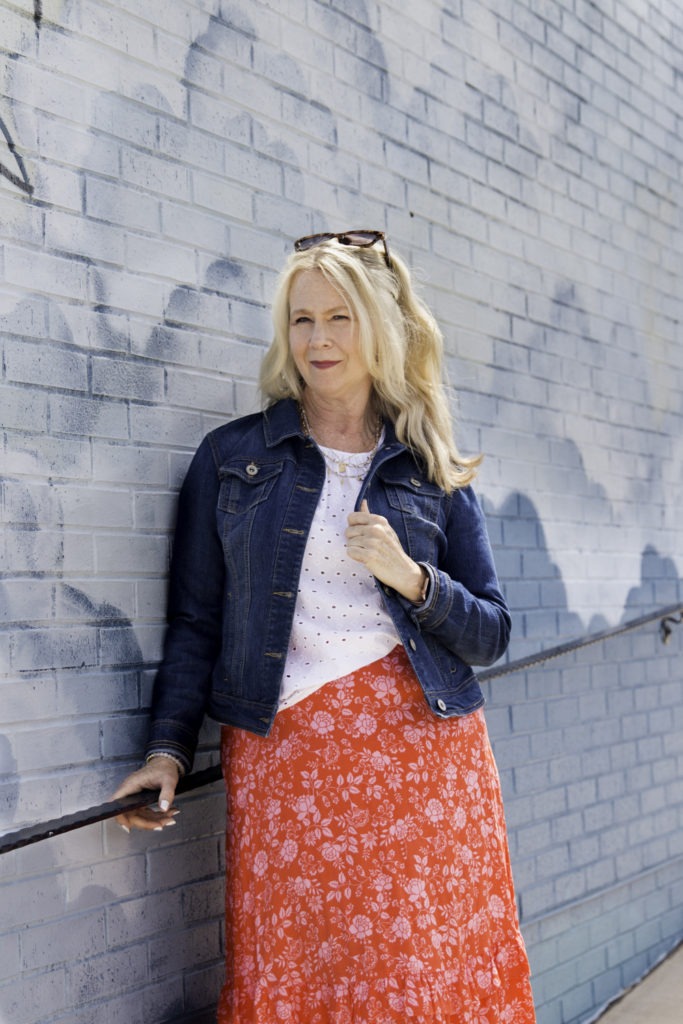 woman in front of mural wall