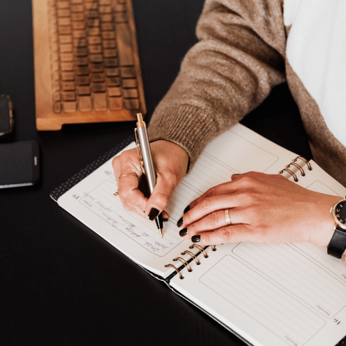 coach writing in journal